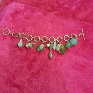 Gold colored Designer bracelet with green stones